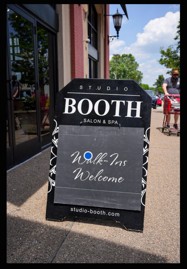 Studio Booth Walk-Ins Welcome sidewalk sign at Bakery Square